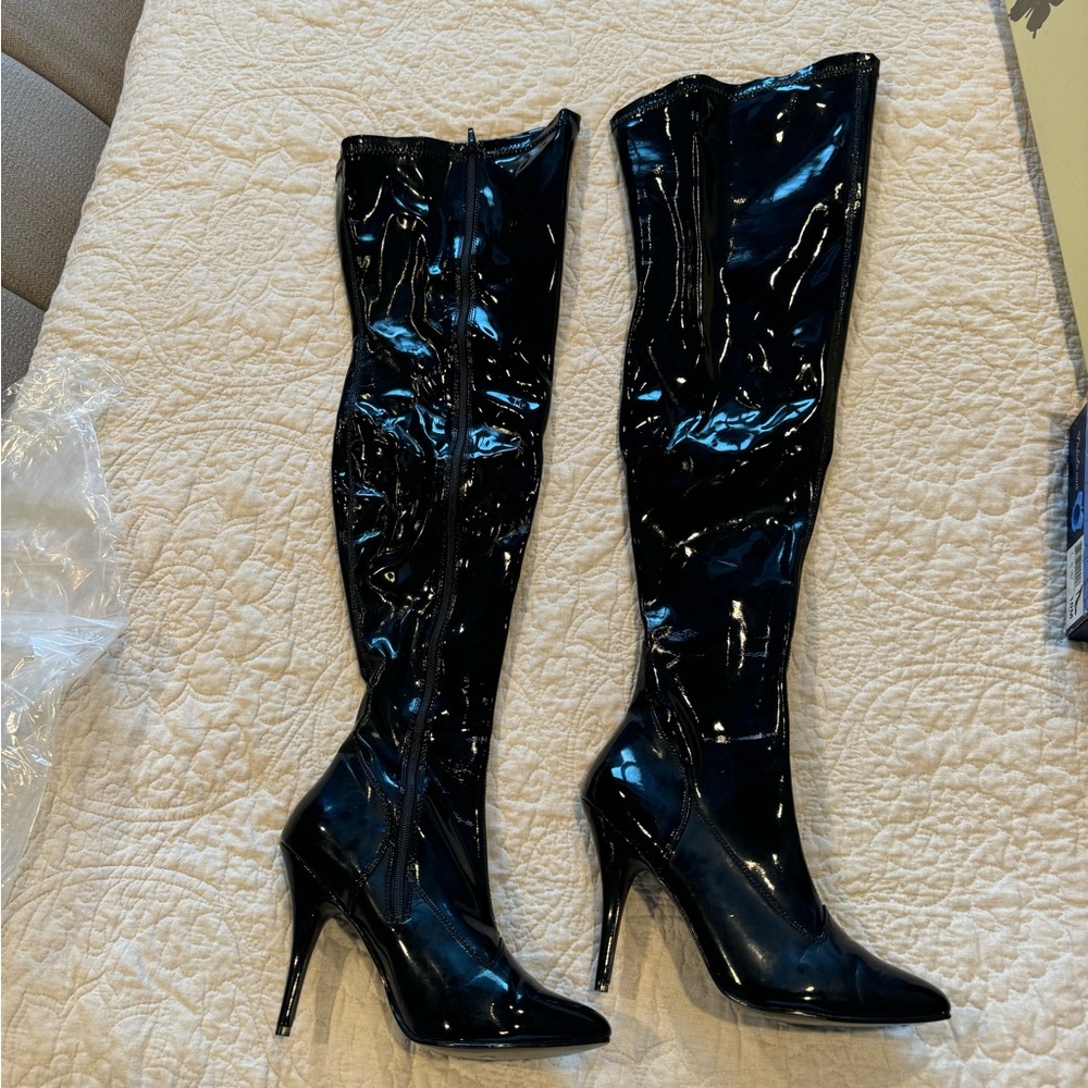 Thigh high stiletto pleather zip up boots. Size 10.